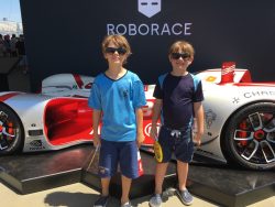Dylan and Alex with self-drive, electric race car at 2017 Formula E Series, Brooklyn, New York City.