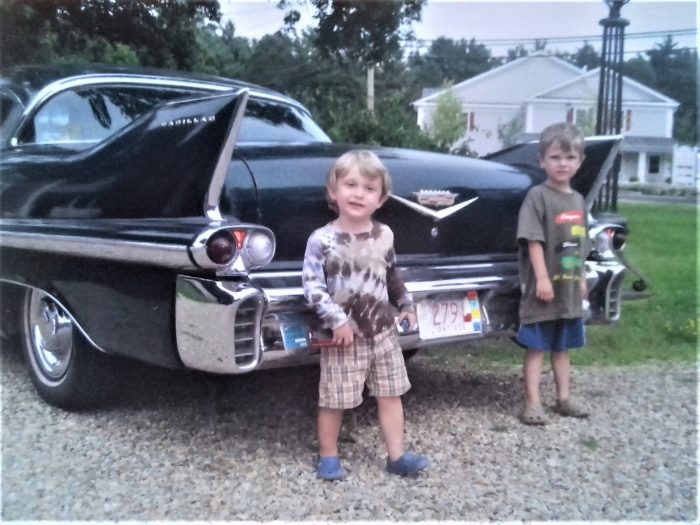 My boys with a 1957 Cadillac Coupe DeVille. Mystic, MA, USA, 2010